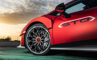 Red sports car sunset clouds - the sun setting behind free wallpaper