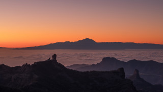 Mountain top sunset clouds mountains - below them free wallpaper