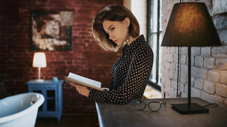 Woman reading book brickwall lamp - in a room free wallpaper