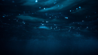 Dark blue ocean bubbles surfer - a surfboard free wallpaper for desktop