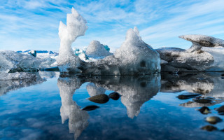 Iceberg lake rocks clouds mountains - a group of icebergs free wallpaper