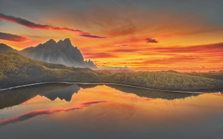 Mountain lake sunset clouds mystical 4 - a painting of a mountain range free wallpaper