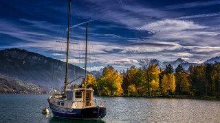 Boat mountain lake forest sunset - yellow leaf free wallpaper