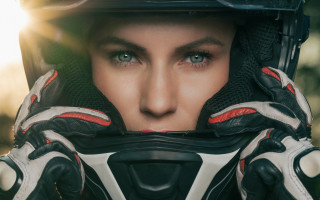 Woman helmet gloves sunshine portrait - a helmet and gloves free wallpaper