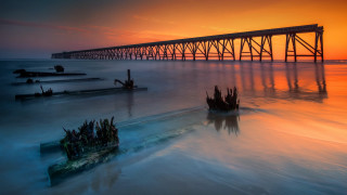 Long bridge water sunset mountains - derold page free wallpaper