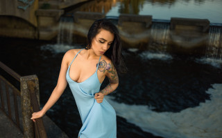 Woman blue dress river bridge - a waterfall in the background free wallpaper