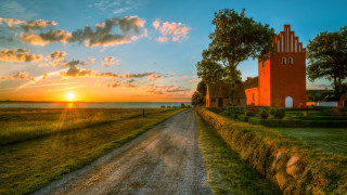 Dirt road red building tower - a red building free wallpaper for desktop