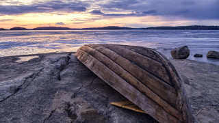 Boat rocks sunset mountains ocean - a boat free wallpaper for desktop