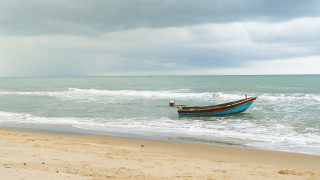 Stormy beach boat person sand - stormy weather free wallpaper for desktop