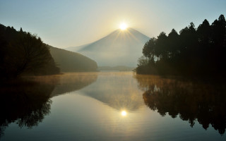 Mountain lake sunrise mist reflection - a lake in front free wallpaper