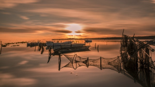 Boats lake cloudy sunset nets - top of a lake under a cloudy sky free wallpaper for desktop