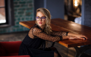 Woman purple glasses red chair - a red chair free wallpaper