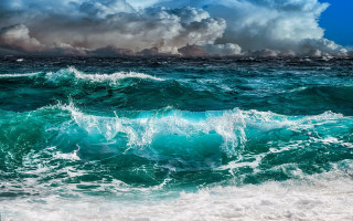 Ocean clouds wave beach mountain - a large body of water free wallpaper