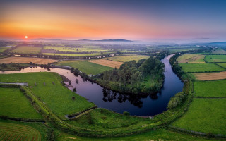 Lush green river sunset landscape - a green field free wallpaper for desktop