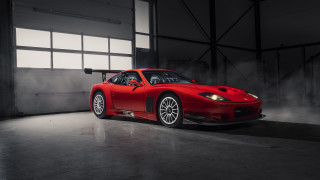 Red sports car garage smokestack - open free wallpaper
