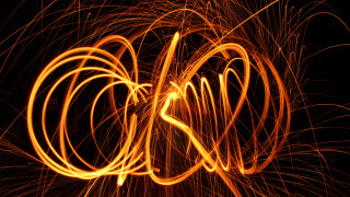 Firework longexposure redlight sparks abstract - a red light in the middle of the image free wallpaper