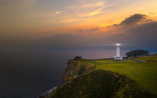 Lighthouse cliff ocean sunset cityscape - a light house free wallpaper