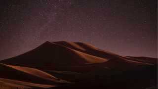 Desert starry sky person hill - a hill in the distance free wallpaper