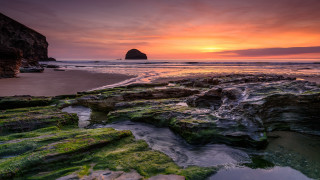 Rocky beach water sunset formation - a rocky beach free wallpaper