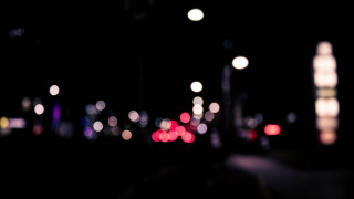 City street night bokeh moon - a blurry photo of a city street free wallpaper