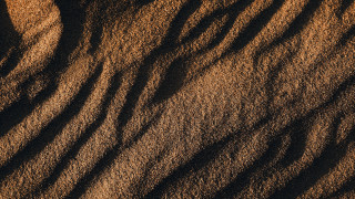 Sand dune closeup brown background - deep free wallpaper