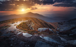 Sunset mountain trail rocks landscape - a sunset over a mountain free wallpaper
