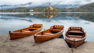 Three wooden boats lake mountains - ferenc joachim free wallpaper