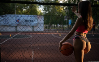 Athletic woman basketball court fence - a court free wallpaper for desktop