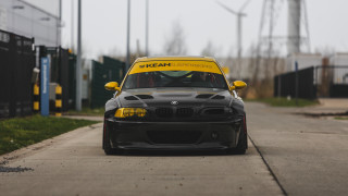 Black car yellow hood street - wide len free wallpaper