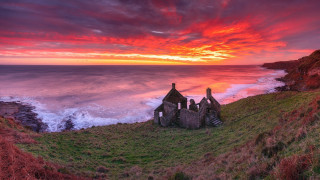 Sunset cliff grassy field water - scene free wallpaper for desktop