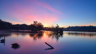 Lake sunset trees reflection clouds - the water and a sunset in the background free wallpaper