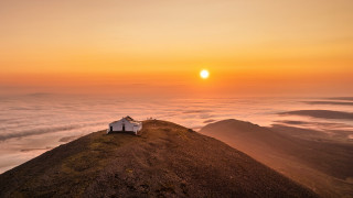 Mountain sunset book clouds ocean - the sun in the distance free wallpaper