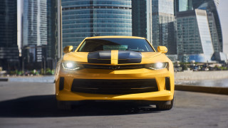 Yellow car black stripe city - a yellow car free wallpaper