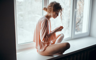 Woman sitting window snow romanticism - the snow outside free wallpaper
