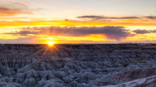 Sunset rocky landscape clouds horizon - a sun free wallpaper for desktop