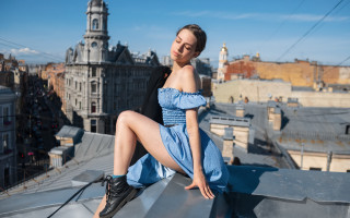 Woman blue dress rooftop city - a clock tower in the background free wallpaper