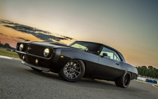 Black muscle car sunset clouds - a black muscle car free wallpaper