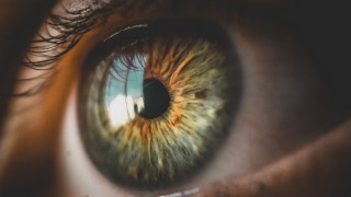 Eye green iris blue sky - a close up of a persons eye free wallpaper