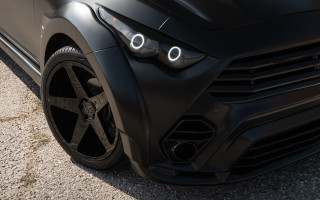 Black car closeup front bumper - a black car free wallpaper