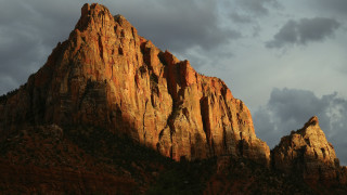 Mountain rockface cloudy sky evening - rim light free wallpaper for desktop