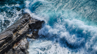 Rock outcropping wave ocean cliff - a wave free wallpaper