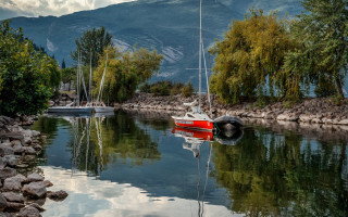 Calm river mountain boat reflections - calm free wallpaper