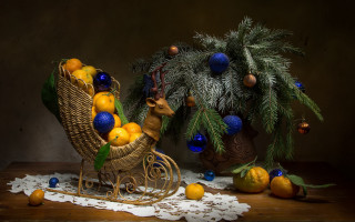 Christmas rockingchair oranges pinecones stilllife - a christmas scene free wallpaper