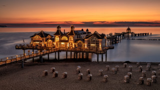 Pier building night lights romanticism - a pier free wallpaper for desktop