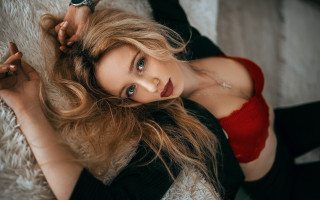 Woman blonde portrait laying redtop - black pants free wallpaper