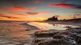 Sunset beach castle water reflection - a sunset over a beach free wallpaper