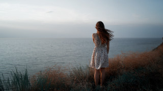 Woman cliff ocean wind dress - the ocean free wallpaper