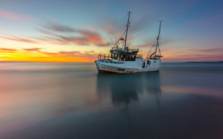 Boat sunset reflection colorful sky - a boat free wallpaper for desktop