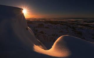 Sunset snowy mountain backlight ocean - the cloud free wallpaper