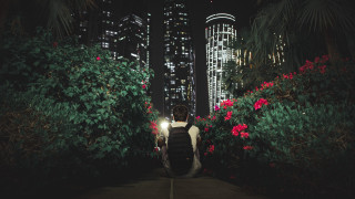 Night cityscape man walking backpack - a backpack free wallpaper